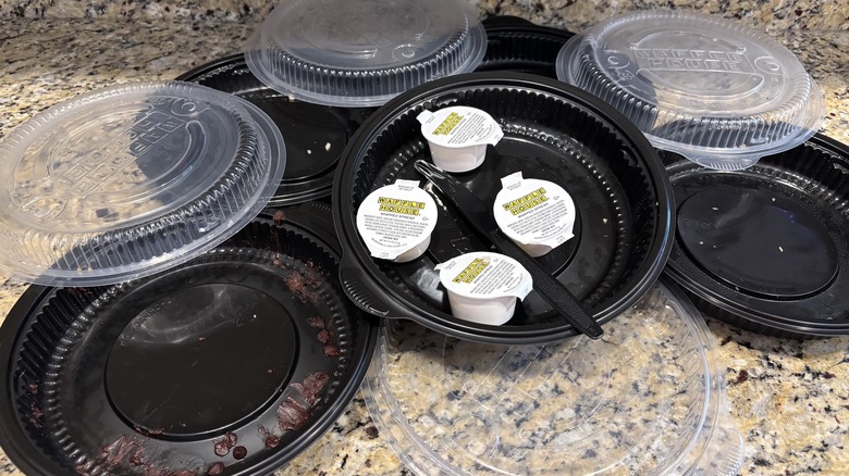 Waffle House waffle to-go containers on marble counter