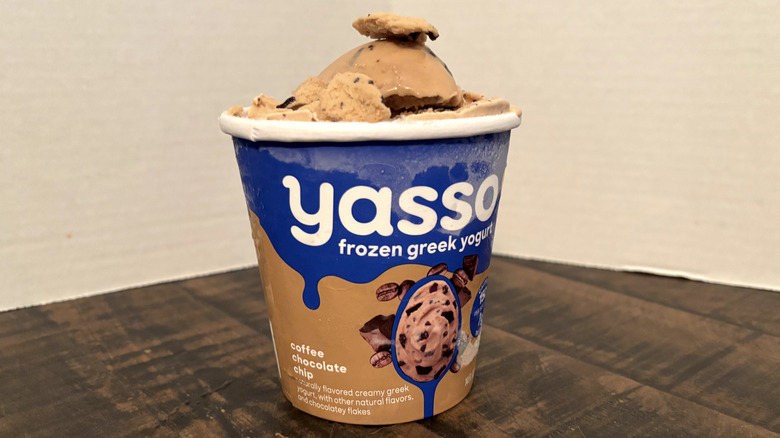 Yasso coffee chocolate chip frozen yogurt in pint on wooden table