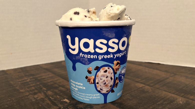 Yasso chocolate chip cookie dough frozen yogurt in pint on wooden table