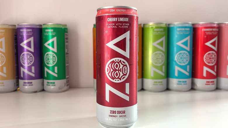 Can of Cherry Limeade ZOA energy drink on white table, other cans behind