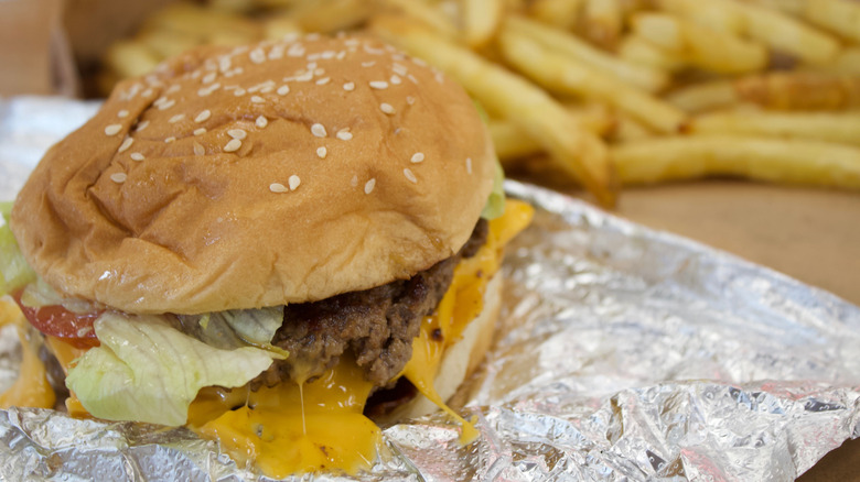 a close up of a burger and fries from Five Guys