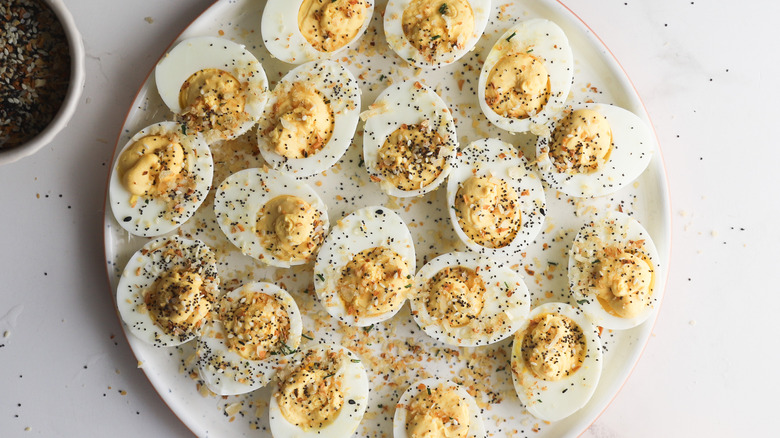 Deviled eggs topped with spice