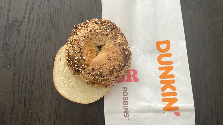 Top view image of Dunkin' Donuts everything bagel on a take-out bag