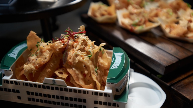 crab nachos in ferry boat souvenir container