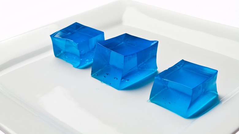 cubes of blue gelatin on a white dish
