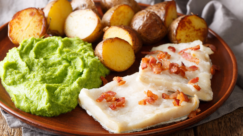 Lutefisk with potatoes, bacon, and mashed green peas