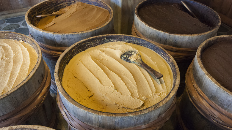 Barrels of miso with spoons 