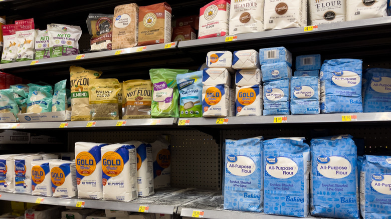 bread flour and all purpose flour shown on the shelves at a supermarket