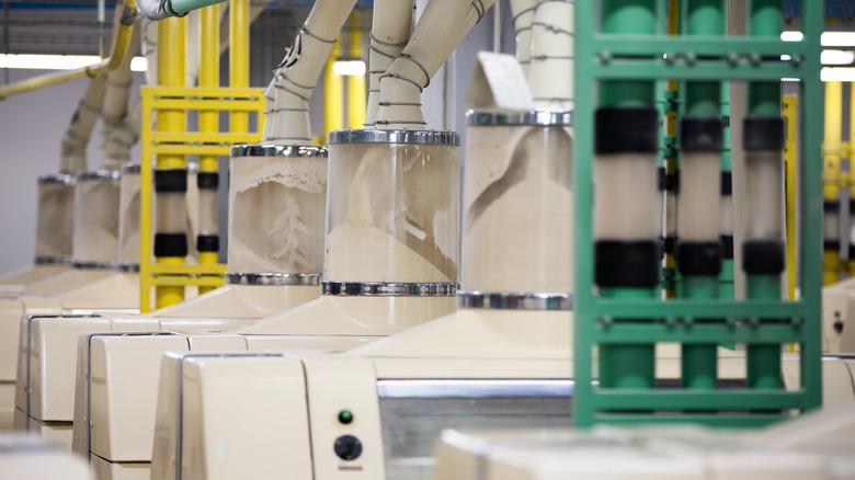 a modern, high-speed industrial mill grinding flour