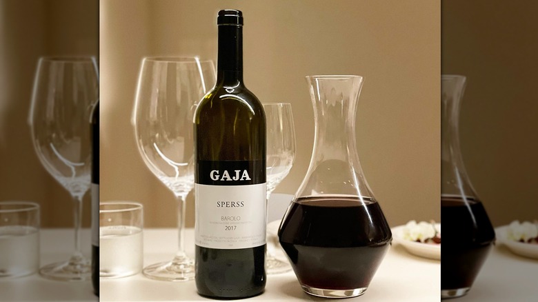 Bottle of Gaja Sperss Barolo with decanter and glass