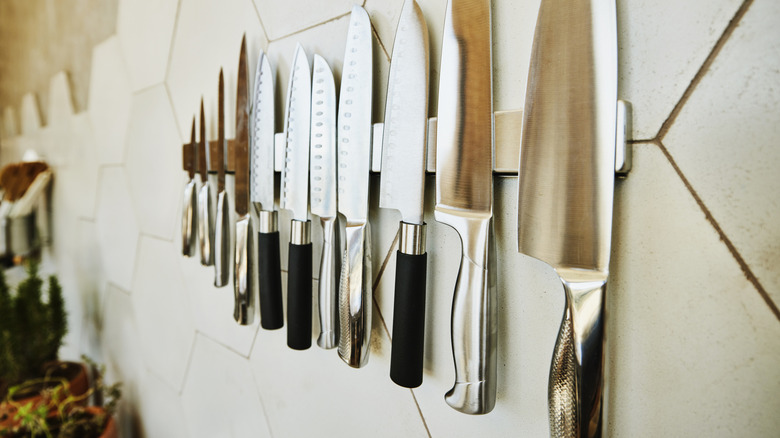 Premium chef's knives on a magnetic block on the all