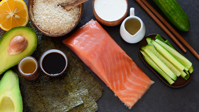 Ingredients for sushi on black table