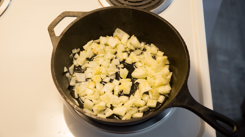 onion sauteing in iron pan