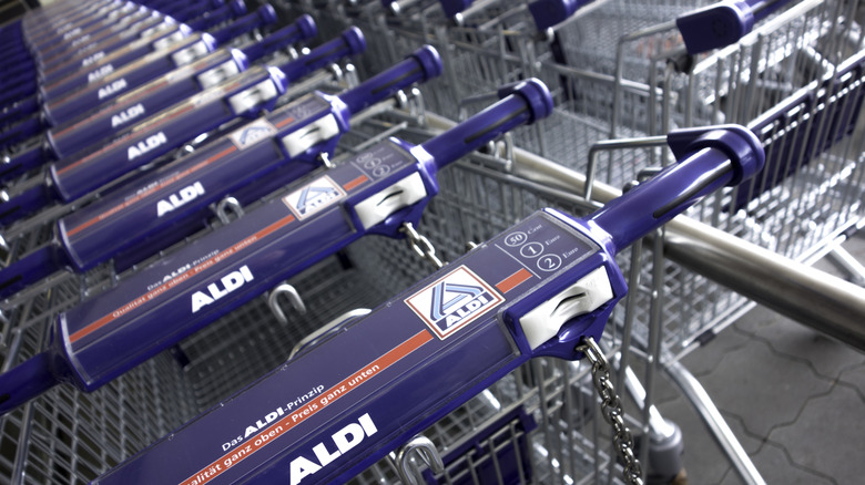 Close-up of Aldi shopping carts with quarter slot