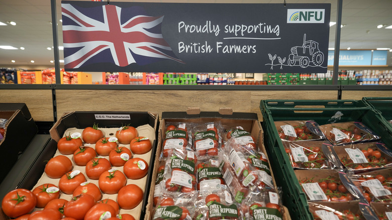 Tomatoes at Aldi under sign stating their from local, Birtish farms