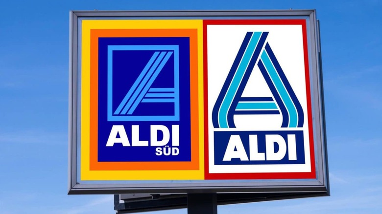 Two different Aldi logos on one sign against blue sky
