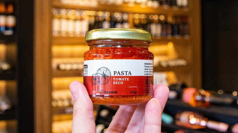Jar of sun-dried tomato paste in a store