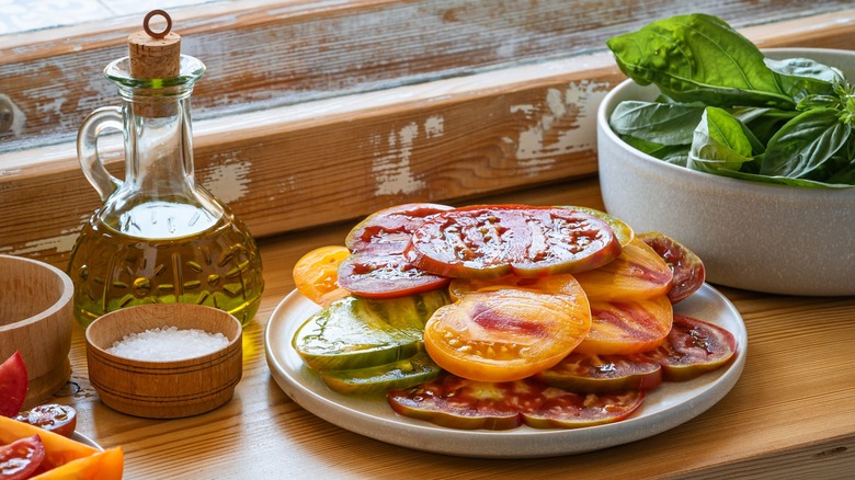 Sliced fresh tomatoes, basil, oil and salt