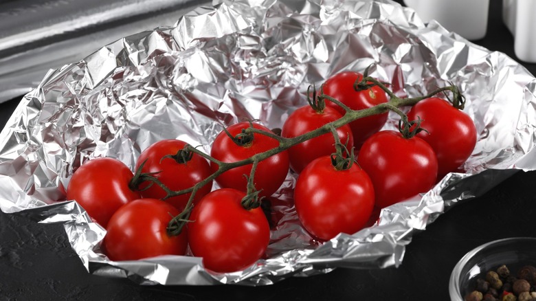 Fresh vine tomatoes on foil
