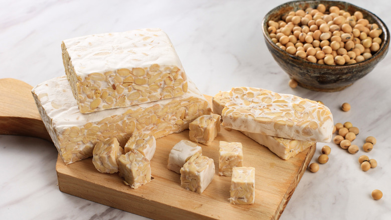 Cut tempeh on wooden board