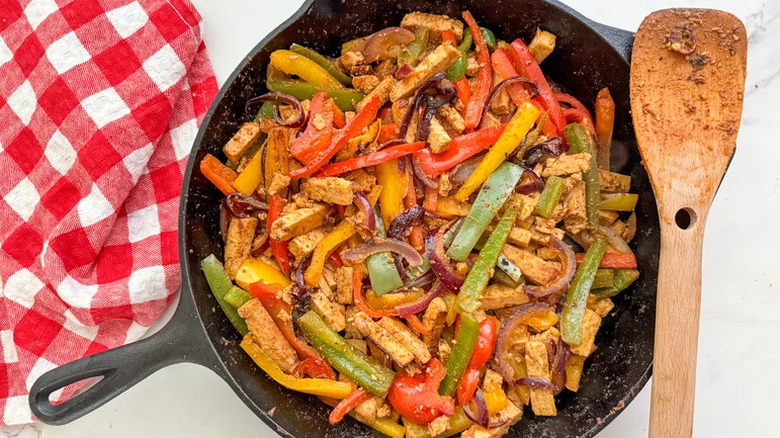 Sizzling Tofu Fajitas in black cast iron skillet