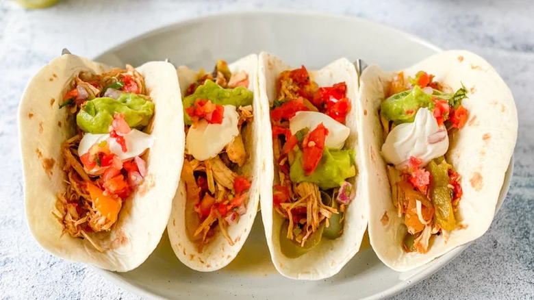 Slow Cooker Chicken Fajitas arranged on white plate