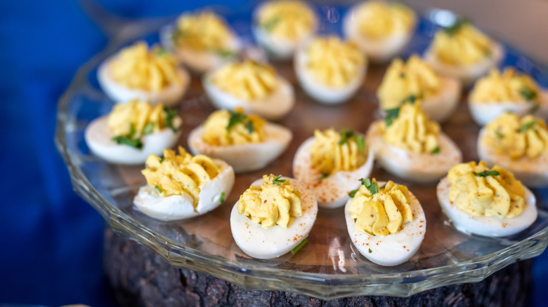 Deviled eggs on a glass serving tray