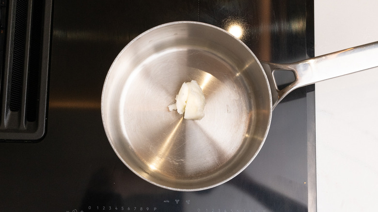 saucepan containing coconut oil