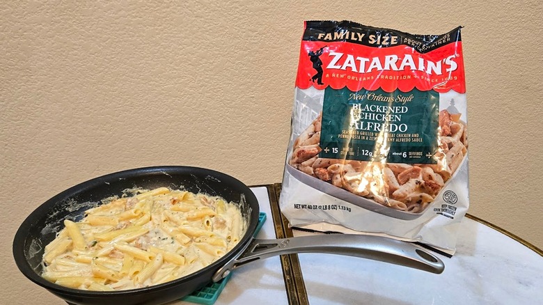 Bag and skillet of Zatarain's Frozen Blackened Chicken Alfredo.