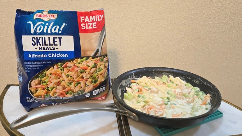 Skillet and bag of Birds Eye Voila! Alfredo Chicken.