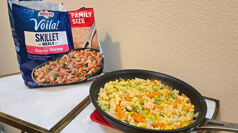 Bag and skillet of Birds Eye Voila! Garlic Shrimp.