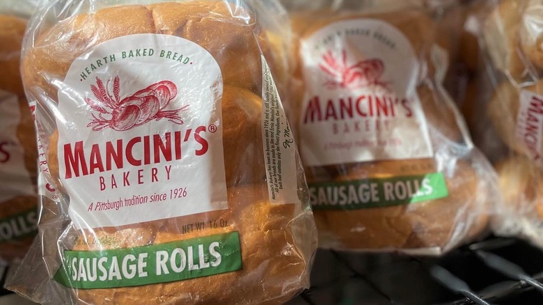 Bags of Mancini's sausage rolls on a shelf