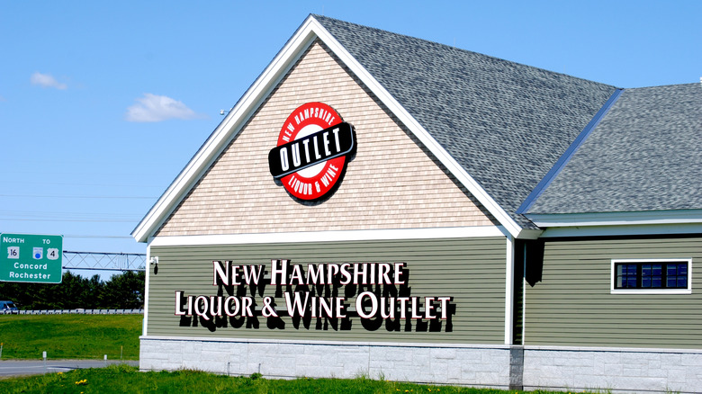 The outside of a New Hampshire Liquor & Wine Outlet showing the sign and logo