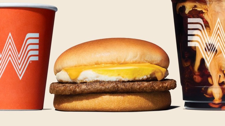 Sausage, egg, and cheese breakfast sandwich with coffee