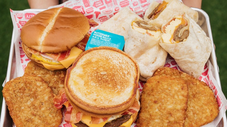 Breakfast items from Jack in the Box including breakfast sandwiches, hash browns, burritos, and ranch sauce