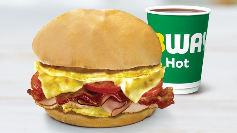 Breakfast sandwich with bacon, ham, tomato, cheese, and egg from Subway