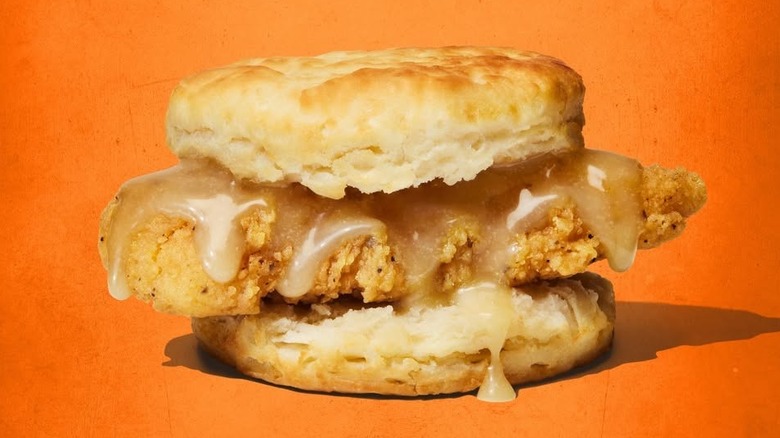 Honey Butter Chicken Biscuit from Whataburger on orange background