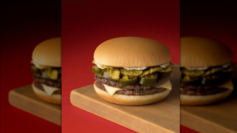 McDonald's Jalapeño McDouble on a wooden plate