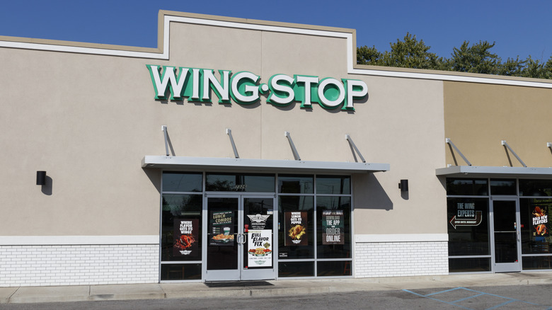Outside the front of a Wingstop chain restaurant