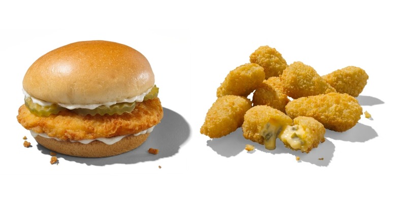 Chicken sandwich with mayo and pickles next to breaded cheesy jalapeño poppers