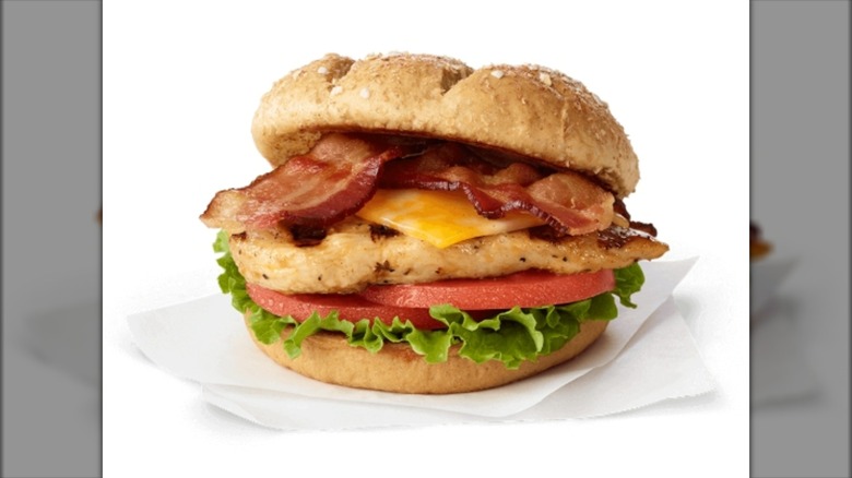 Grilled chicken sandwich with bacon, cheese, tomato, and lettuce
