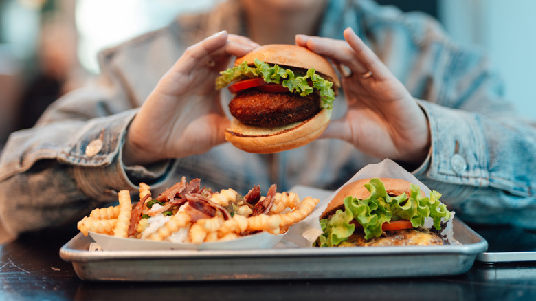fast food burger and fries on tray