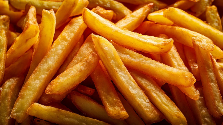 Close-up of crispy golden fries cooked in beef tallow
