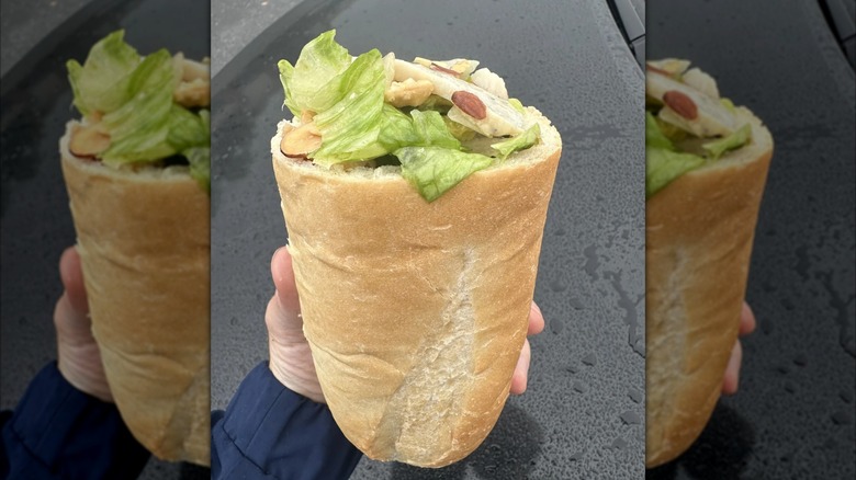 Mirrored image of hand holding Panera's Salad Stuffer