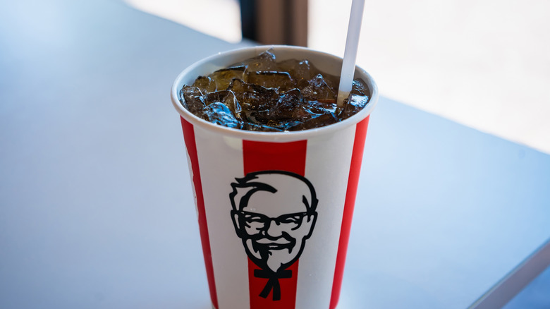 Close-up of ice and soda in KFC cup