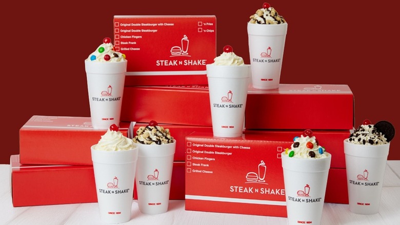 Seven Steak 'N Shake milkshakes with takeout boxes