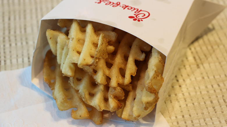 Close-up of Chick-fil-A waffle potato fries in a cardboard carton