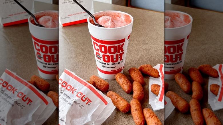 Cook Out's hushpuppies spilling from a bag next to a milkshake