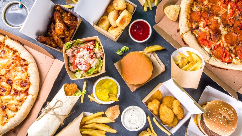 Top view of various fast food mains and sides