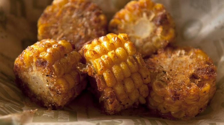 Wingstop's Cajun fried corn pieces on branded parchment paper